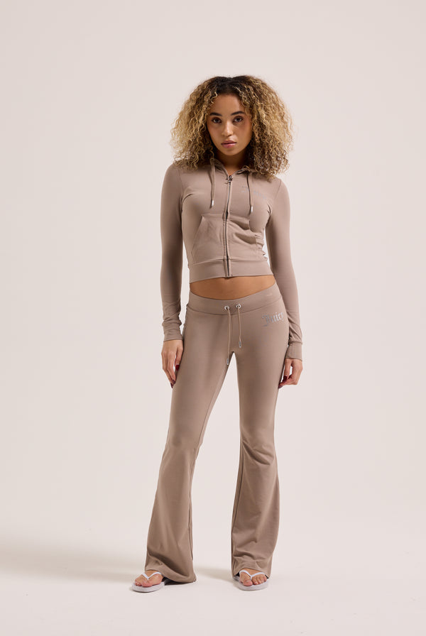 Displays a model wearing the Fungi 'Juicy' Couture diamanté luxury jersey zip through hoodie 