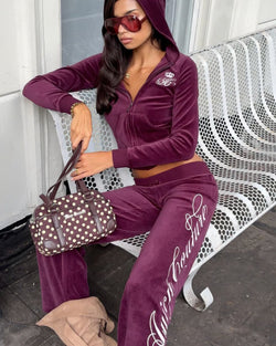 Displays a model wearing the Chocolate Brown 'Juicy' branded Double Zip Opening Shoulder Bag