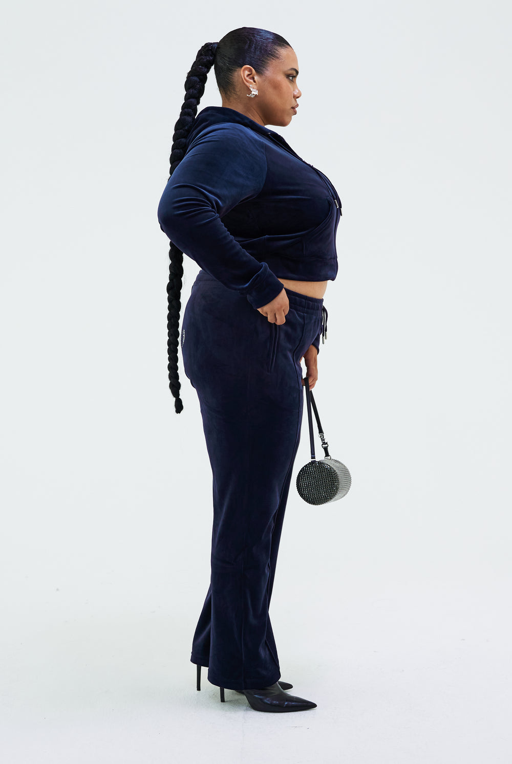 Displays a model wearing the Night Sky 'juicy' branded velour diamanté tracksuit bottom