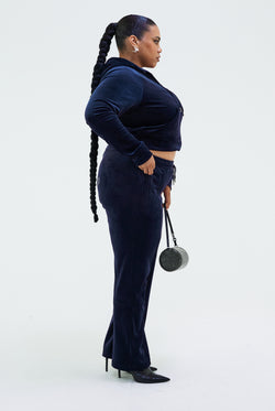Displays a model wearing the Night Sky 'juicy' branded velour diamanté tracksuit bottom