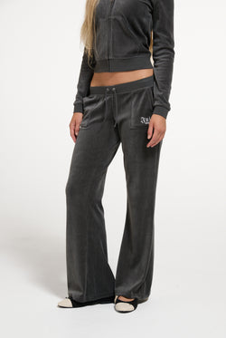 Displays a model wearing the Raven 'Juicy' branded Regal Rebelle Caisa Ultra Low Rise Pant