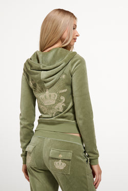 Displays a model wearing the Oil Green 'Juicy' branded Regal Rebelle Robyn Hoodie
