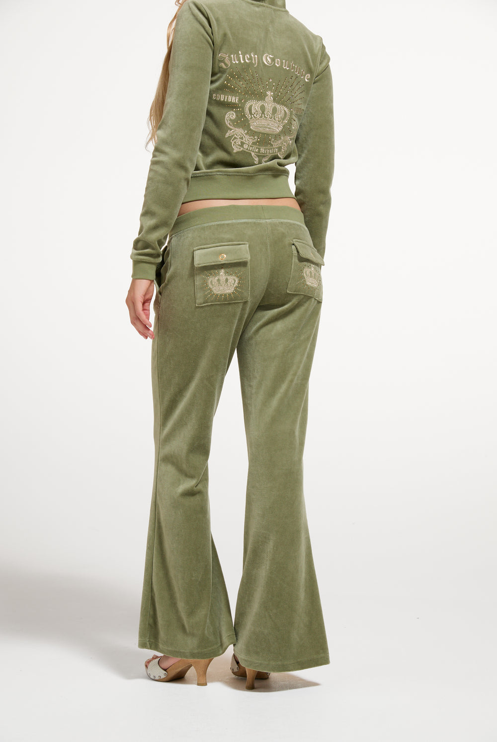 Displays a model wearing the Oil Green 'Juicy' branded Regal Rebelle Caisa Ultra Low Rise Pant