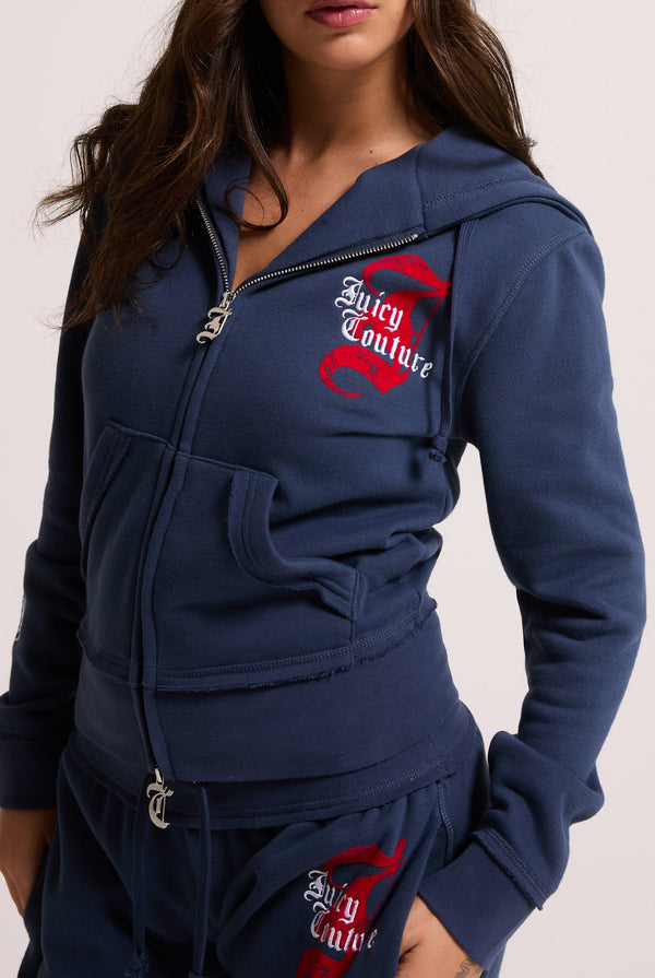 Displays a model wearing the Mood indigo 'juicy' branded longline fleece zip through hoodie 