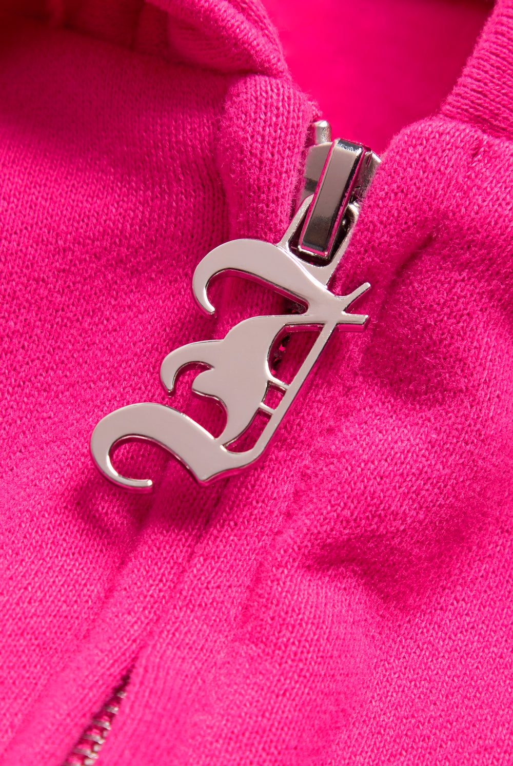 Displays the Nostalgia Pink 'Juicy' branded Longline Fleece Zip-Through Hoodie featuring the juicy branding on the zip 
