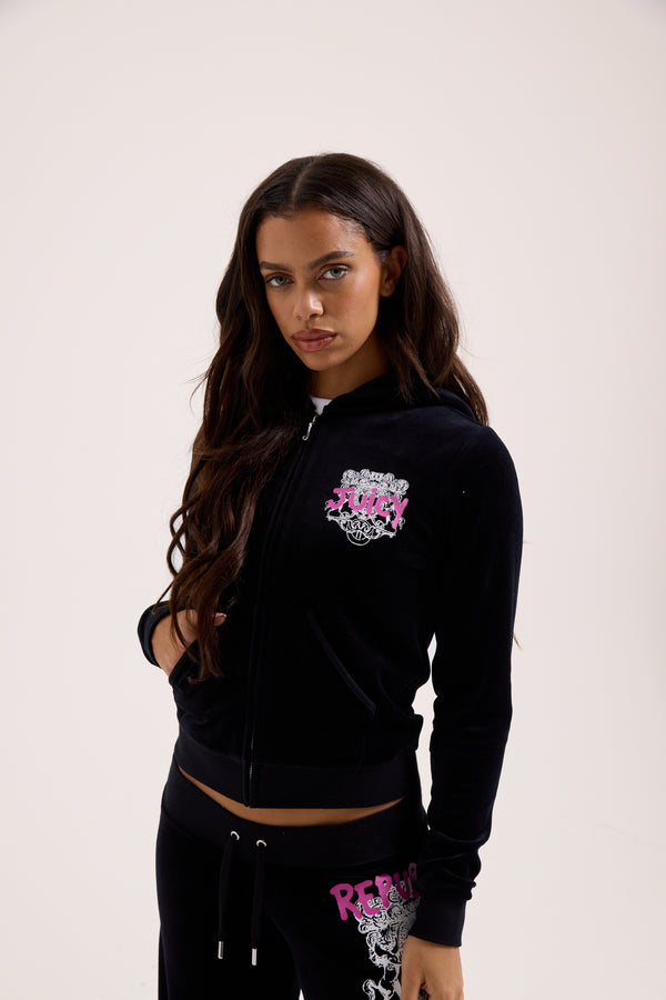 Displays a model wearing the Black Juicy Couture & Roxy Republic of heritage hoodie 