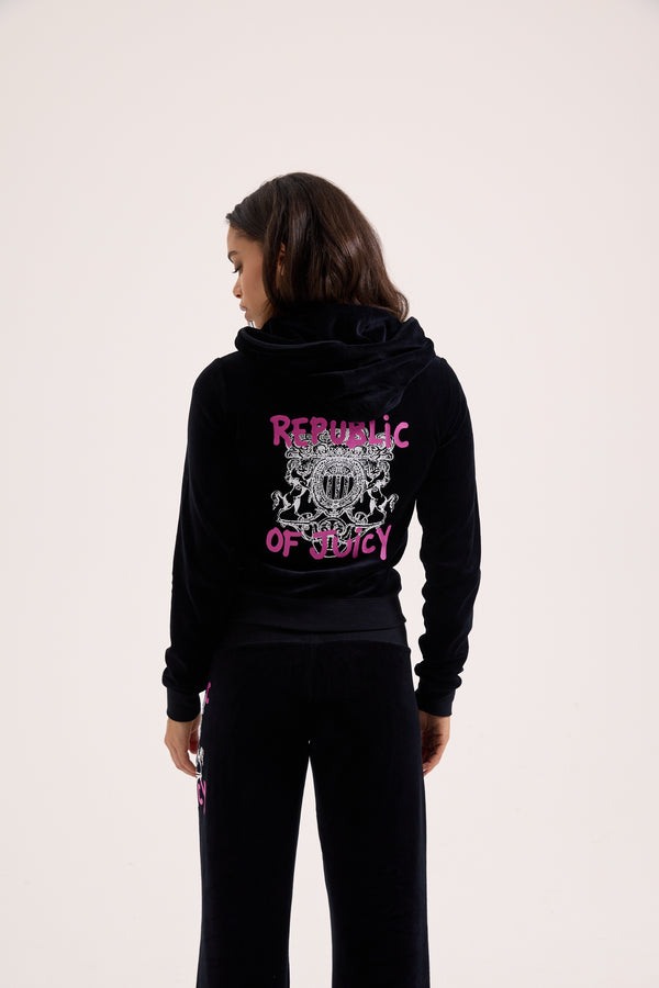 Displays a model wearing the Black Juicy Couture & Roxy Republic of heritage hoodie 