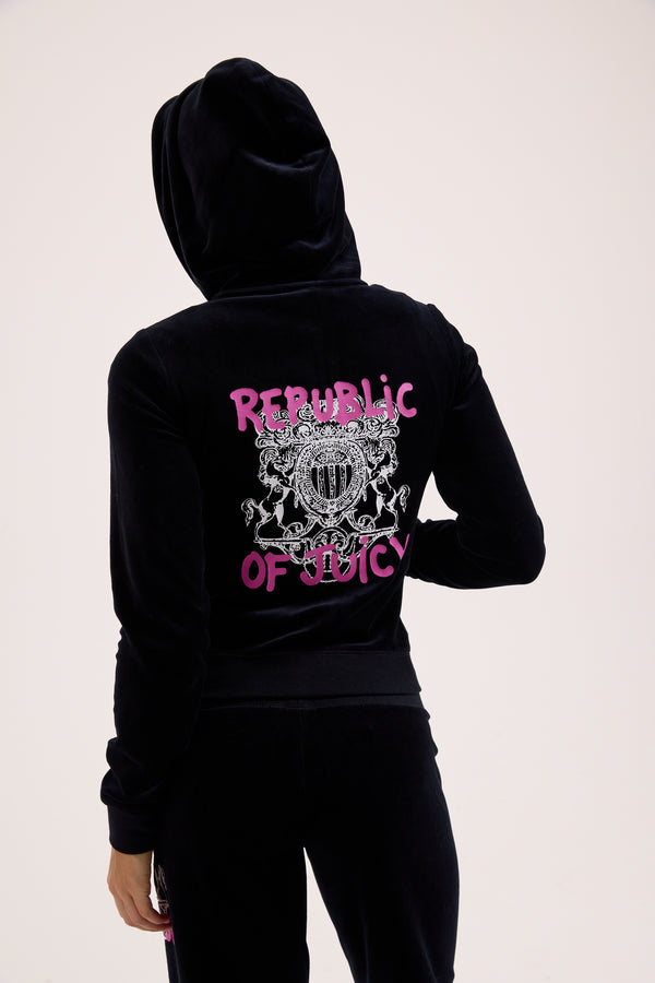 Displays a model wearing the Black Juicy Couture & Roxy Republic of heritage hoodie 