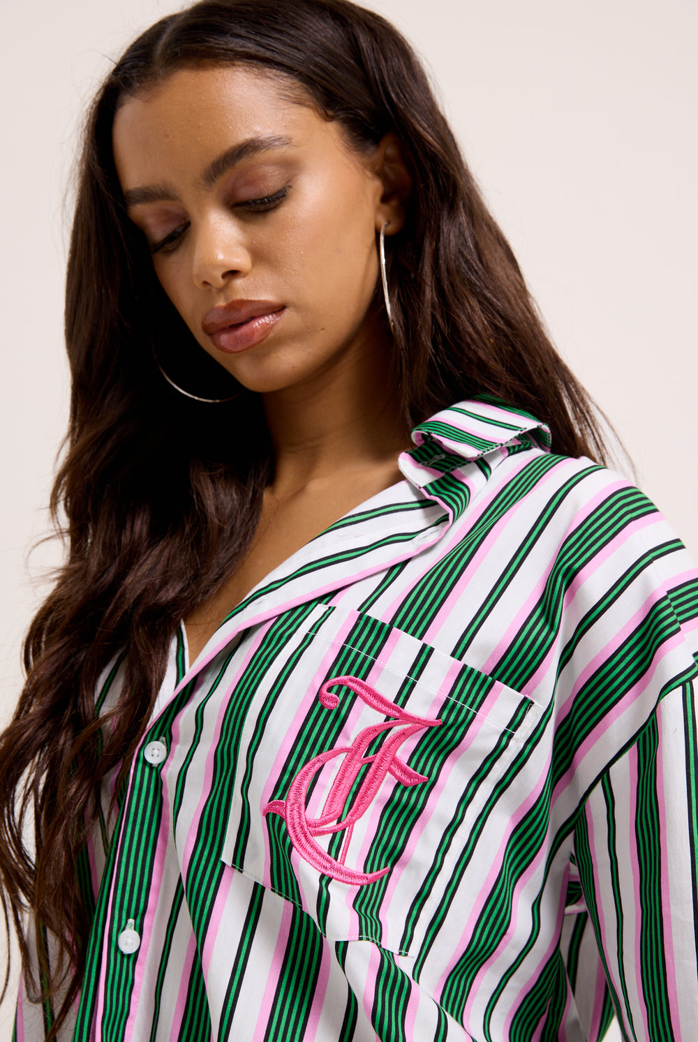 Displays a model wearing the Green stripe 'juicy' branded cotton sleep shirt 