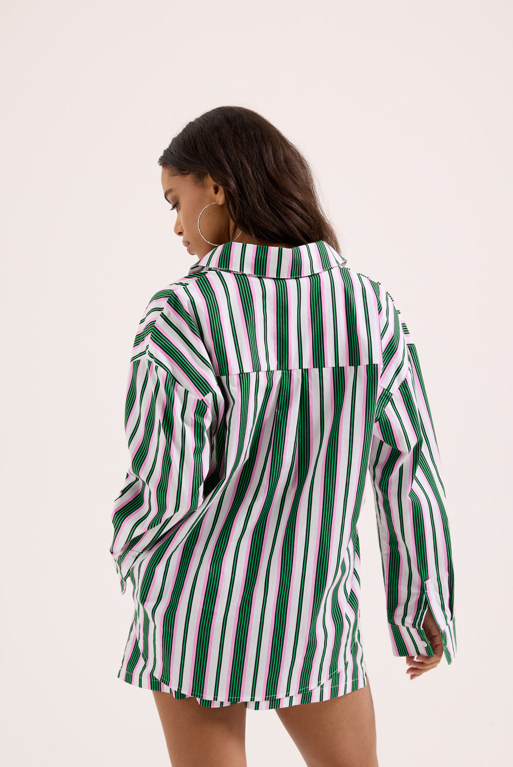 Displays a model wearing the Green stripe 'juicy' branded cotton sleep shirt 