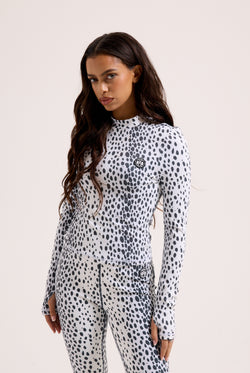 Displays a model wearing the Ski Snow Leopard print 'Juicy' branded long sleeve top 