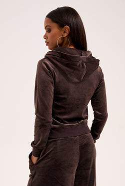 Displays the model wearing the Java & Gold 'Juicy' branded classic velour Robertson hoodie 
