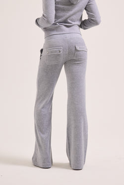 Displays a model wearing the Silver Marl Low Rise 'Juicy' branded cotton velour track pants