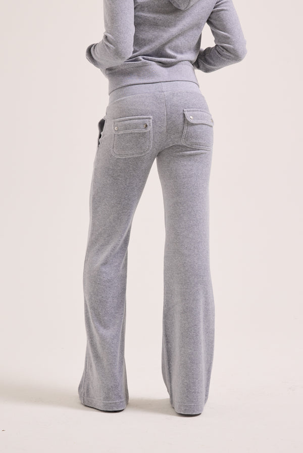 Displays a model wearing the Silver Marl Low Rise 'Juicy' branded cotton velour track pants
