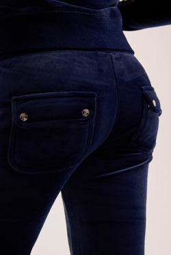 Navy blue pants with button details on a light background