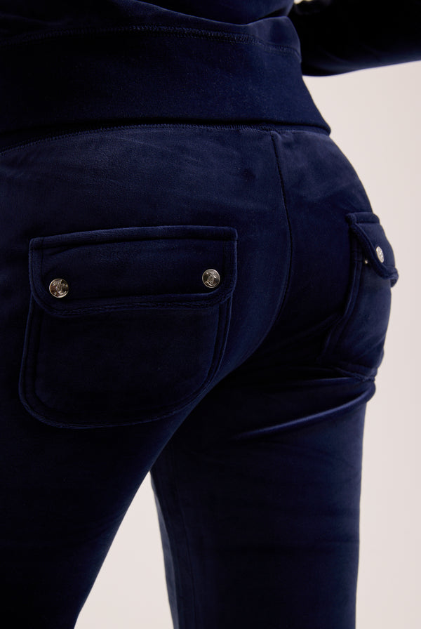 Navy blue pants with button details on a light background