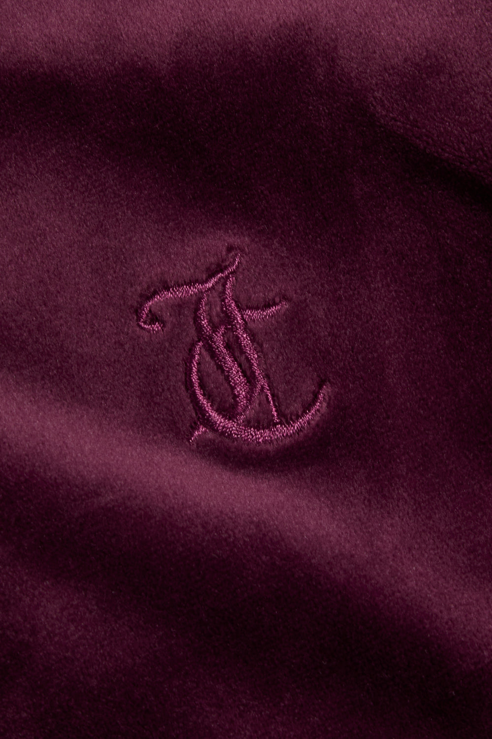 Displays the wine tasting classic 'juicy' branded velour Robertson hoodie featuring the juicy logo