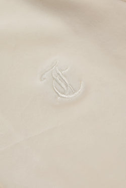 Displays the cream classic 'Juicy' branded velour Robertson hoodie featuring the juicy logo