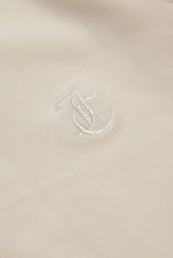 Displays the cream classic 'Juicy' branded velour Robertson hoodie featuring the juicy logo