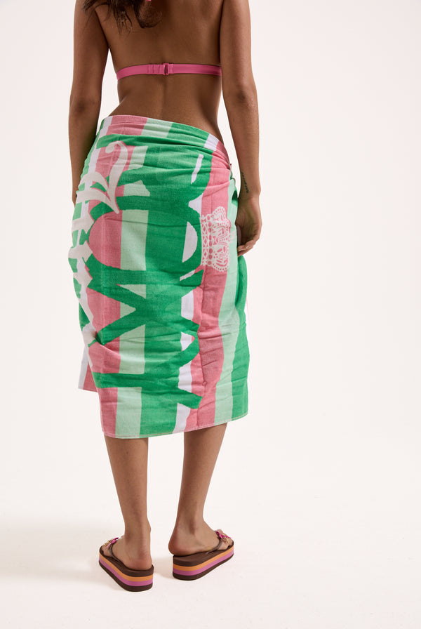 Displays a model wearing the Island green Roxy & Juicy Couture beach towel 