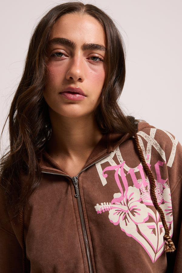 Displays a model wearing the Tiramisu Roxy & Juicy couture boxy hoodie 