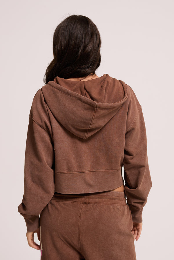 Displays a model wearing the Tiramisu Roxy & Juicy couture boxy hoodie 