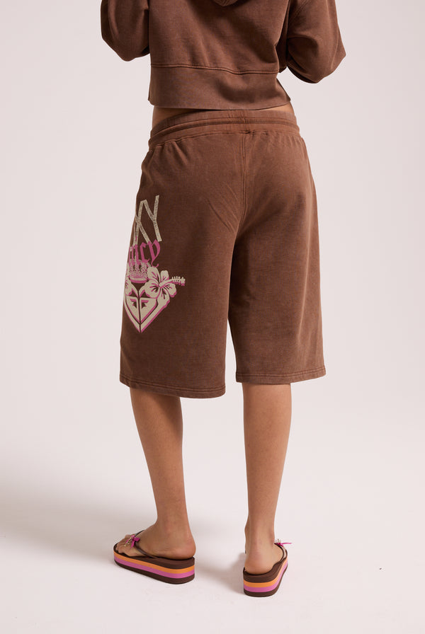 Displays a model wearing the Tiramisu Roxy & Juicy couture relaxed jorts 