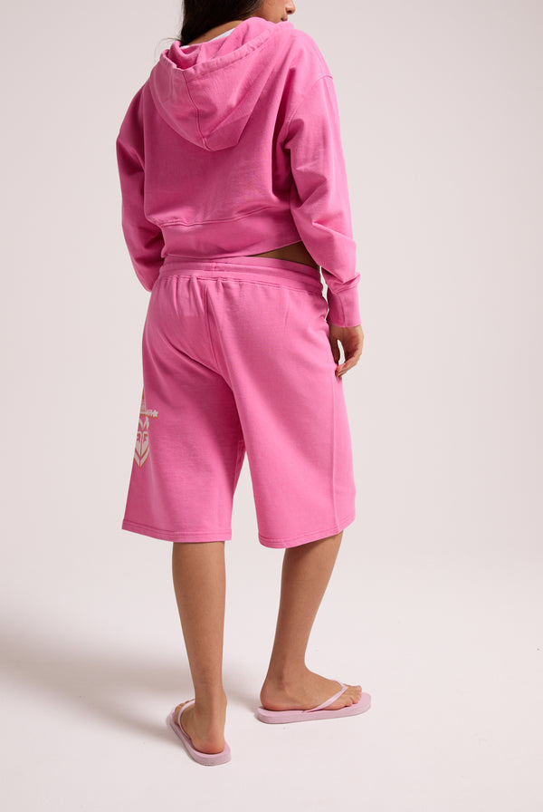 Displays a model wearing the Pink Azalea Roxy & Juicy Couture relaxed jorts 
