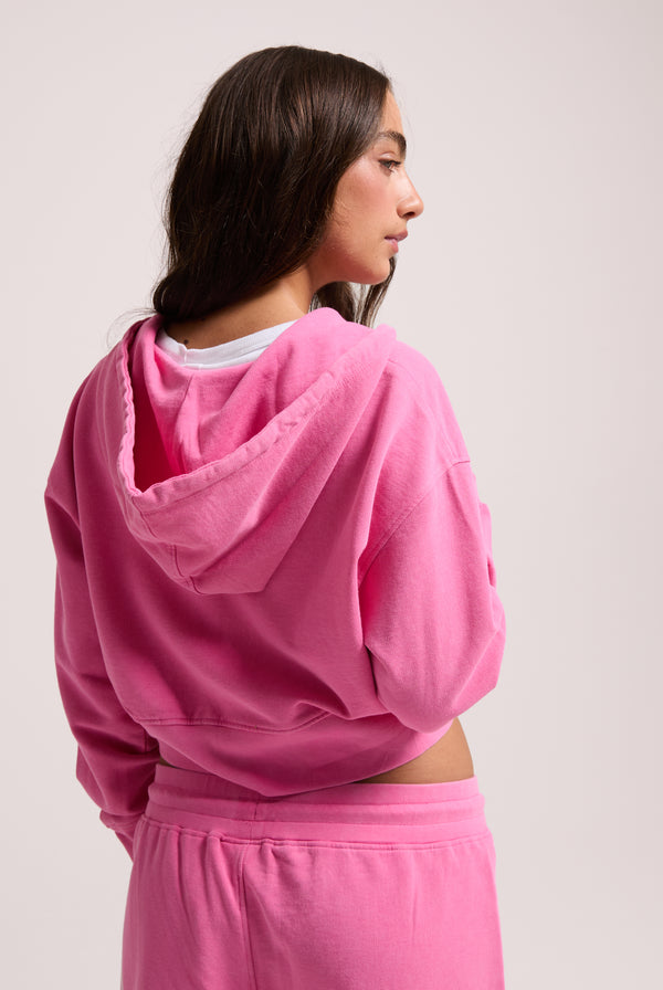 Displays a model wearing the Pink Azalea Roxy & juicy Couture boxy hoodie 
