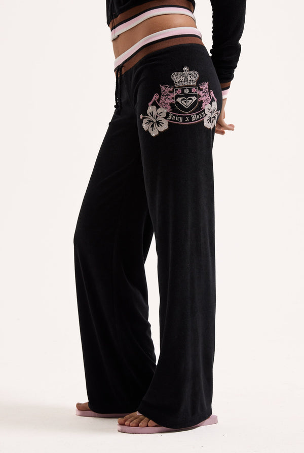 Displays a model wearing the Black Roxy & Juicy Couture Terry towelling og straight  bottoms