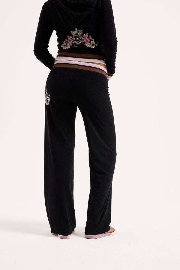 Displays a model wearing the Black Roxy & Juicy Couture Terry towelling og straight  bottoms