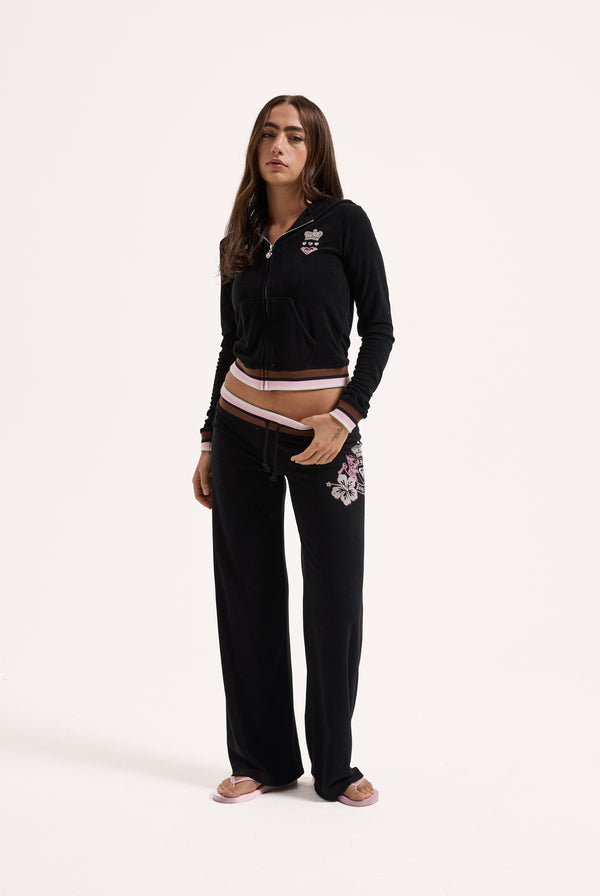 Displays a model wearing the Black Roxy & Juicy Couture Terry towelling og straight  bottoms