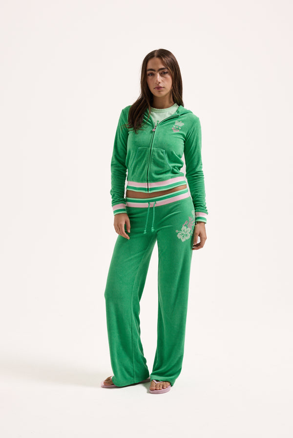 Displays a model wearing the island green Roxy & Juicy Couture Terry towelling hoodie 
