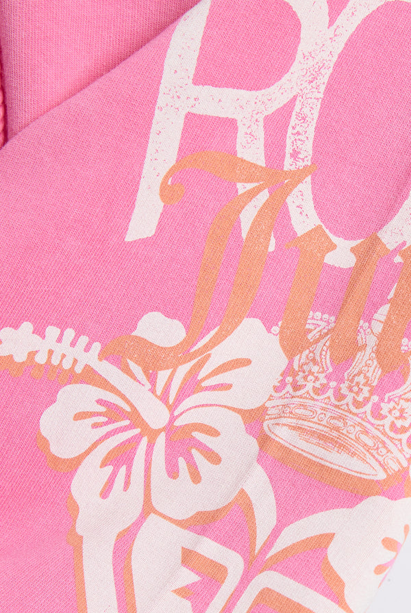 Displays the Pink Azalea Roxy & Juicy Couture relaxed jorts featuring the Roxy x juicy logo