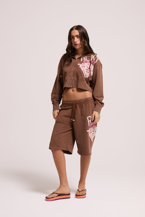 Displays a model wearing the Tiramisu Roxy & Juicy couture boxy hoodie 