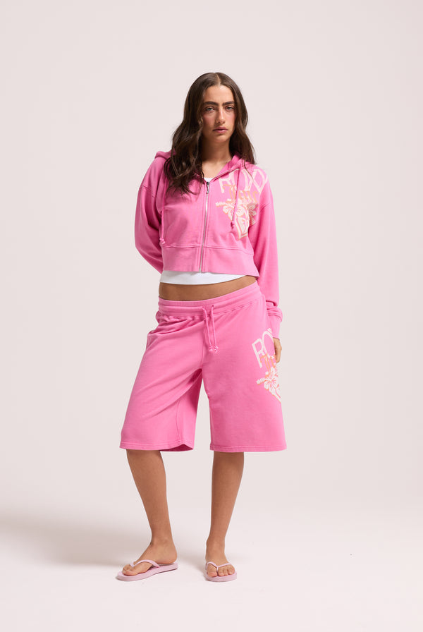 Displays a model wearing the Pink Azalea Roxy & juicy Couture boxy hoodie 