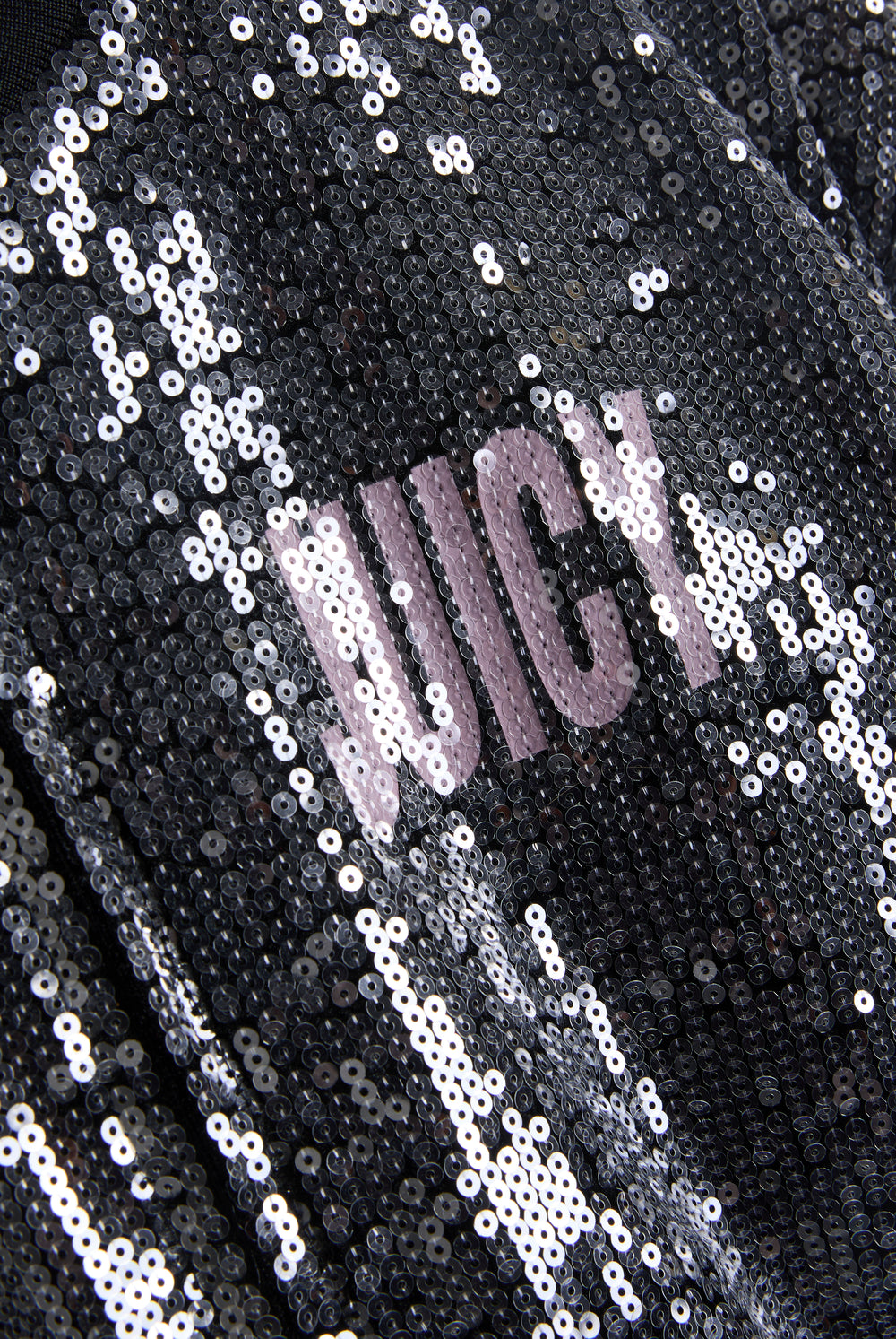 Displays the 'juicy' branded choose juicy sequin cropped bomber featuring the juicy branding 