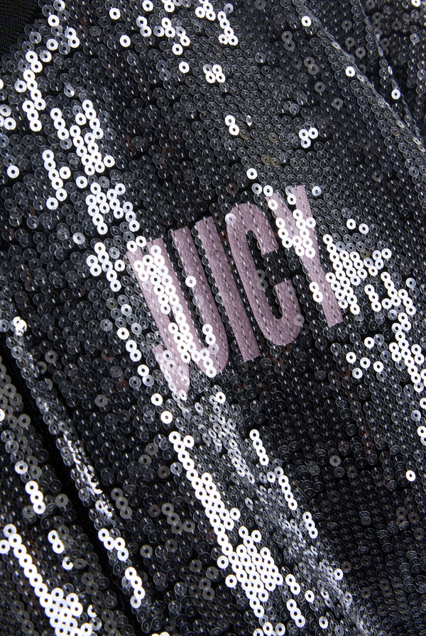 Displays the 'juicy' branded choose juicy sequin cropped bomber featuring the juicy branding 