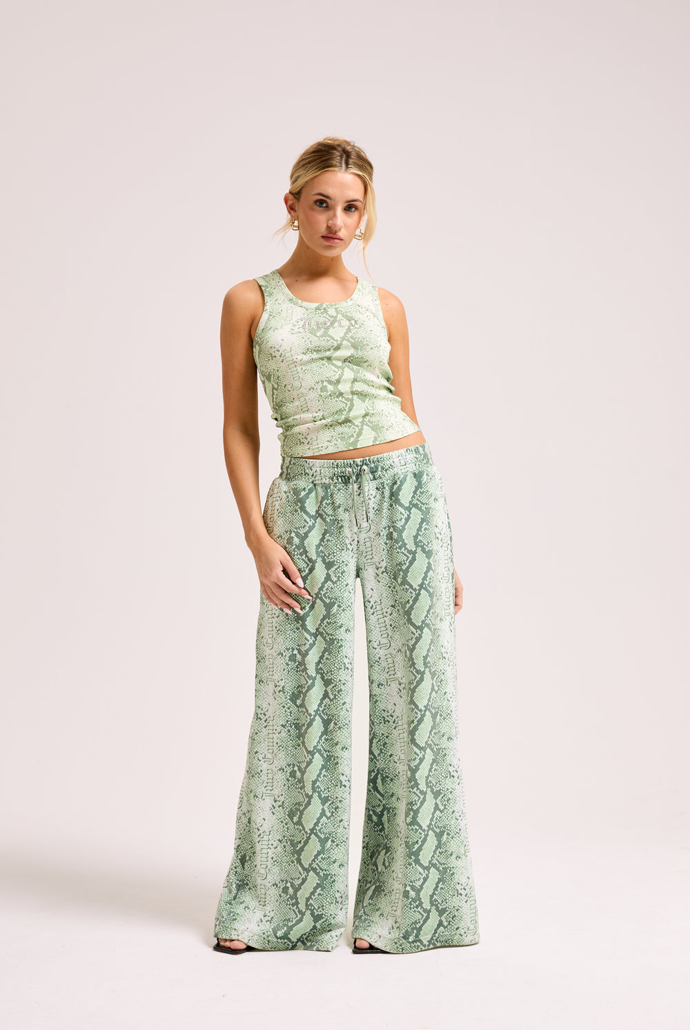 Displays a model wearing the Green Snake print 'Juicy' branded diamanté vest 