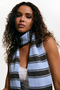 Displays a model wearing the Java Stripe 'Juicy' branded  Knit Scarf