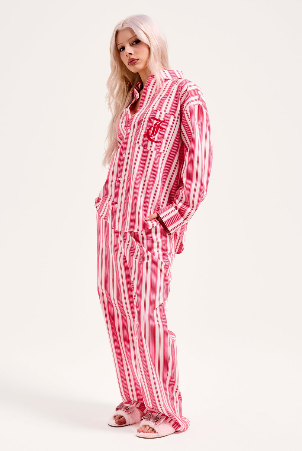 Displays a model wearing the Pink Stripe 'Juicy' branded oversized sleep shirt 