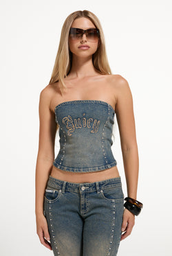 Displays a model wearing the Mid Wash 'Juicy' branded Sand Denim Studded Corset Top