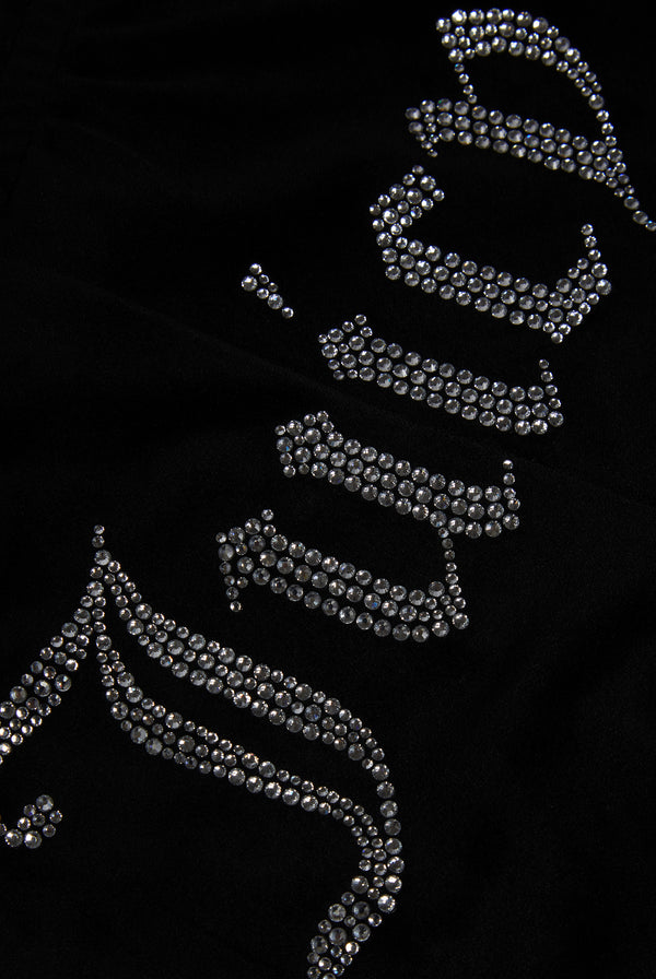 Displays the Black 'Juicy' branded velour diamanté track shorts featuring the juicy branding 