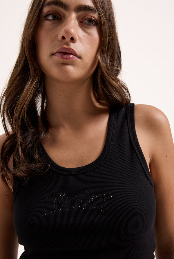 Displays a model wearing the Black 'Juicy' branded ribbed outline diamanté racer vest