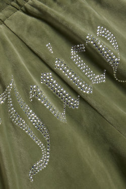 Displays the Oil Green 'Juicy' branded Velour Diamanté Tracksuit Bottom featuring the juicy branding 