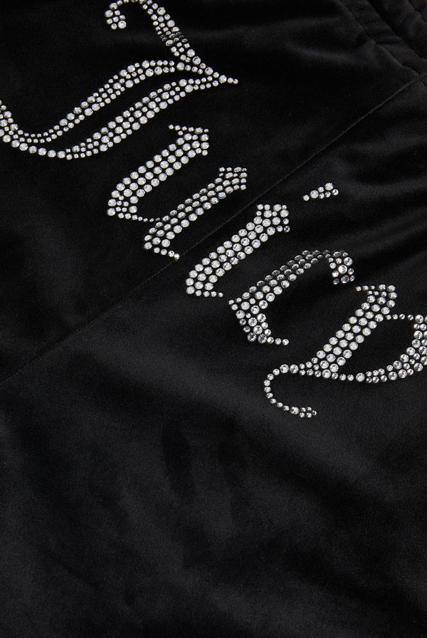 Black velour tracksuit bottoms with diamanté branding on the back