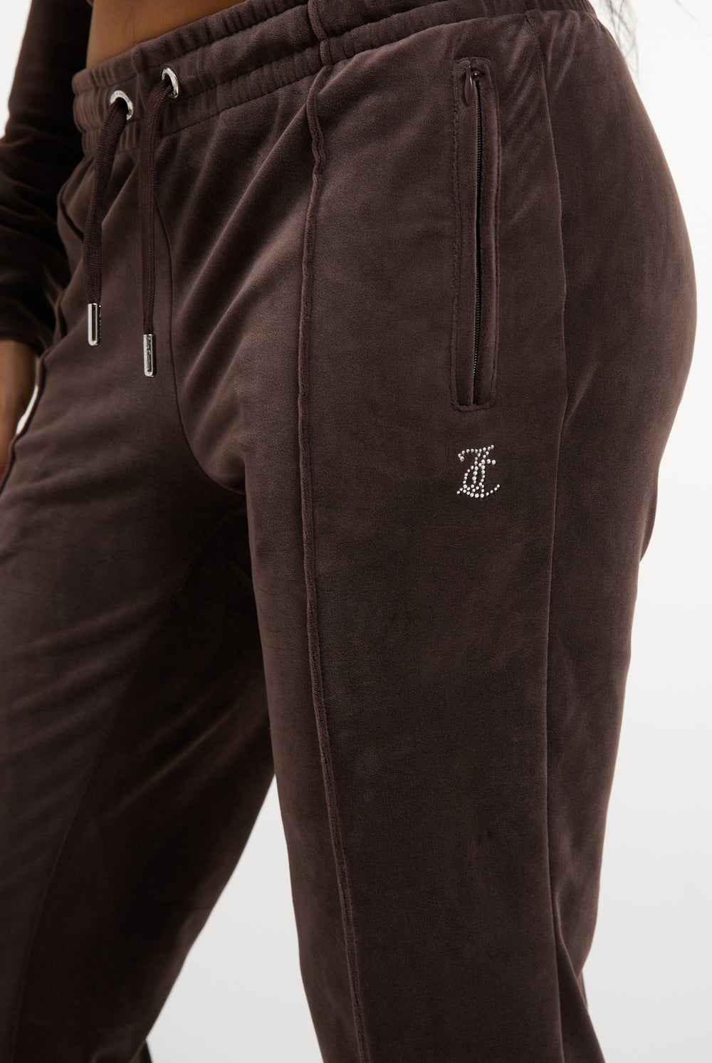 Displays a model wearing the Java 'Juicy' branded Velour Diamanté Tracksuit Bottom