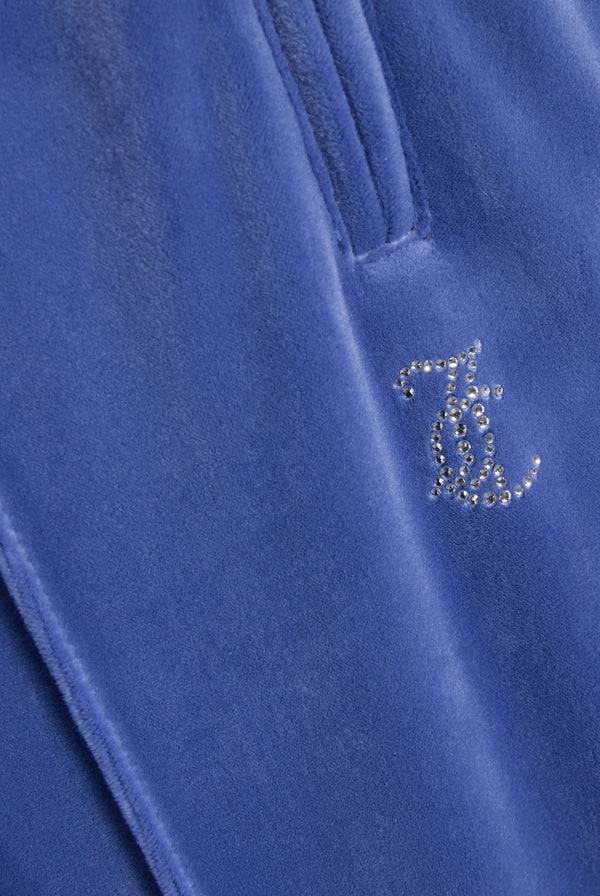 Displays the grey blue 'Juicy' branded velour outline diamanté tracksuit bottom featuring the juicy Couture logo
