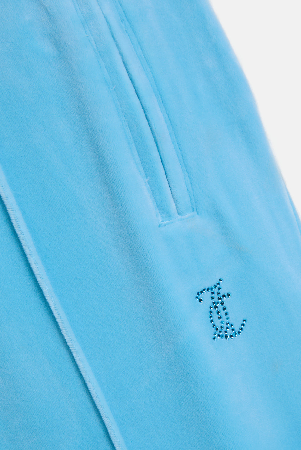 Displays the Sky Blue 'Juicy' branded velour outline diamanté tracksuit bottom featuring the juicy Couture logo 