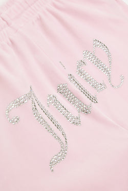 Displays the Almond Blossom 'Juicy' branded velour diamanté tracksuit bottom featuring the juicy branding